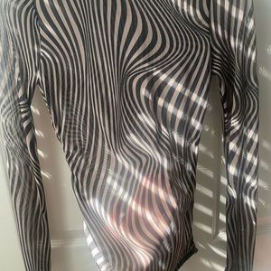 Only worn once. No tears or stains, can’t fit it anymore. See through.